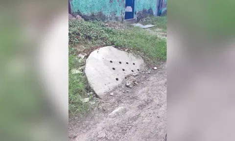 A recharge well half buried under the newly-laid road in the area