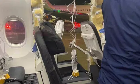 &nbsp;Passenger oxygen masks hang from the roof next to a missing window of an Alaska Airlines Flight 1282 (Reuters)