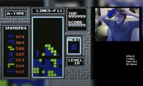 13-year-old Willis Gibson reacts after playing a game of Tetris. (AP)