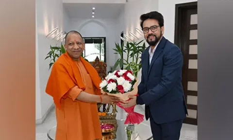 &nbsp;UP CM Yogi Adityanath with Union Minister of Government of India Anurag Thakur in Lucknow. (ANI)