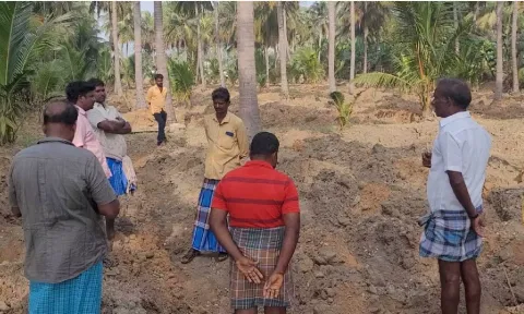 Farmers looking at the land from which the wires were stolen near Gudiyattam