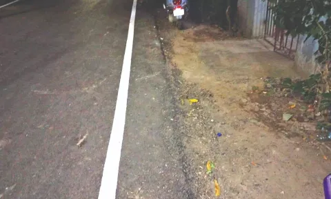Level of tar above pavement on Srinivasan Street