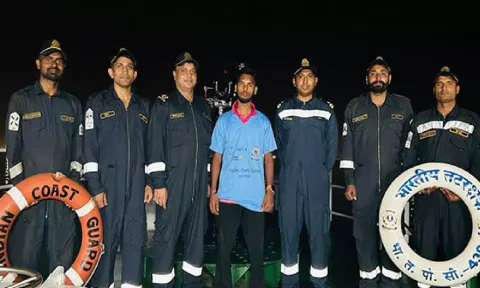 Rescued man with ICG officials (ANI)