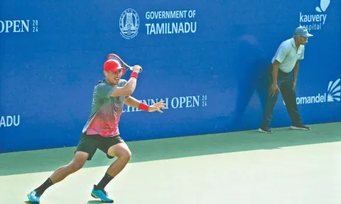 Bernard Tomic in action on Tuesday
