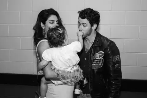 Priyanka Chopra Jonas with Nick Jonas and her daughter