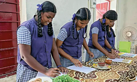 Class 12 students of a school in city attending the practical exams that began across the State on Monday