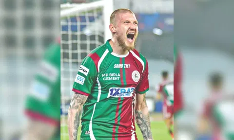 Jason Cummings celebrates after scoring a goal