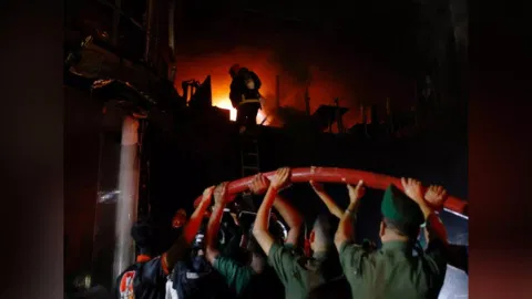 Fire broke out in a multi storey building in Dhaka (Reuters)