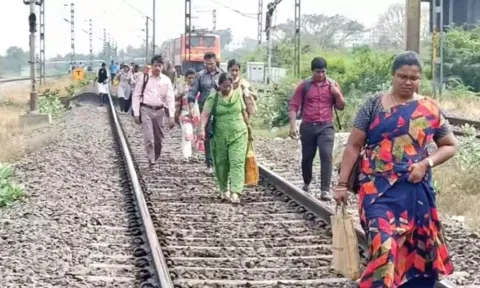 Passengers walked in railway track