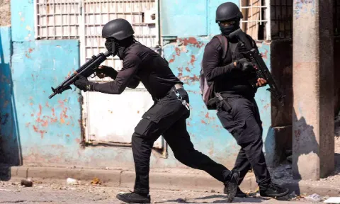 Police officers take part in an operation on the surroundings of the National Penitentiary following a fire (Reuters)