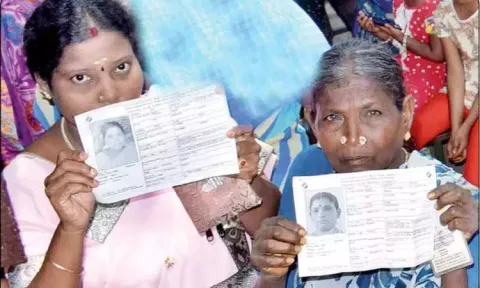 Visuals of women displaying their booth slips (File)