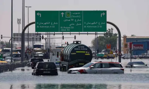 Cars are stranded in flood water on a blocked highway following heavy rainfall in Dubai (Reuters)
