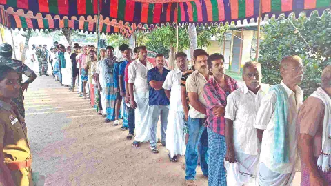 People turn up with enthusiasm to cast their vote at a polling station in Mettupalayam on Friday
