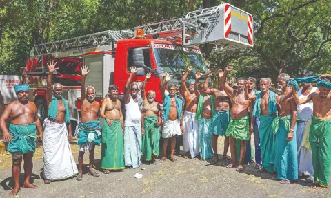 TN farmers protest at Jantar Mantar after grounded from mobile towers by DFS using sky lifts in Delhi on Wednesday