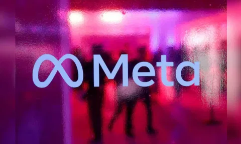 People walk behind a Meta Platform logo during a Conference in Mumbai (Reuters)