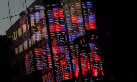 A huge electric stock quotation board is seen inside a building in Tokyo (Reuters)