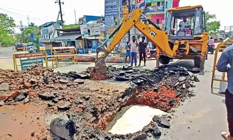 The civic staff fixing the damage caused on the Kumbakonam-Thanjavur highway on Saturday