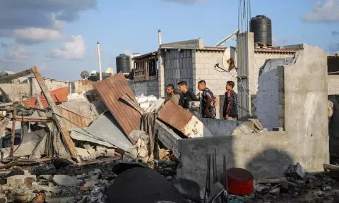 &nbsp;Palestinians inspect the site of an Israeli strike on a house (Reuters)
