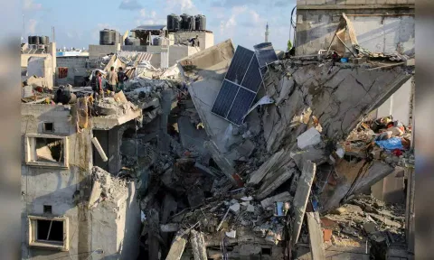 Palestinians inspect the site of an Israeli strike on a house, amid the ongoing conflict between Israel and the Palestinian Islamist group Hamas, in Rafah (Reuters)&nbsp;