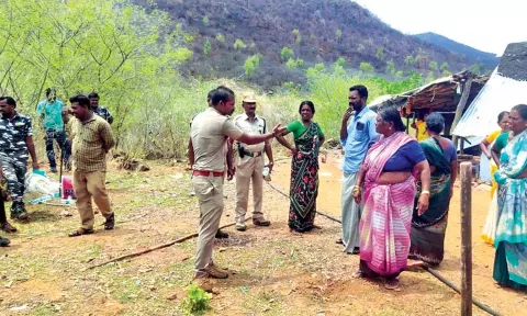 Forest officials arguing with residents during an eviction drive in Hogenakkal on Friday