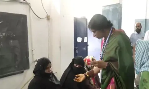 BJP candidate Madhavi Latha checks voter identity cards (ANI)