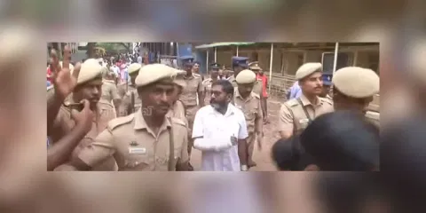 &nbsp;'Savukku' Shankar (in white) being taken from Coimbatore central jail to the government medical college hospital on May 13. (Thanthi TV screengrab)