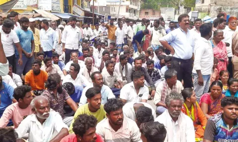 Villagers block the road protesting against the elephant attack which led to the death of a farmer in Krishnagiri