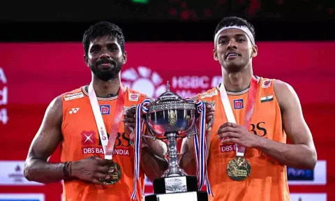 Satwiksairaj Rankireddy (L) and Chirag Shetty pose with the Thailand Open championship