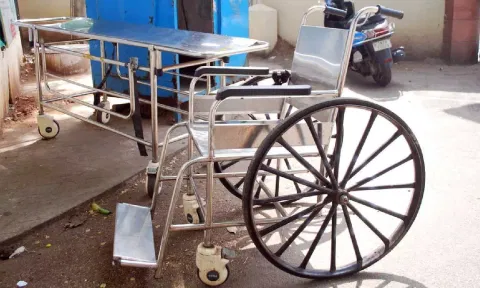 Stretcher and wheelchair kept at the entrance of District Headquarters Hospital in Erode&nbsp;