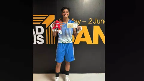 Jasmine poses with her ticket to Paris after the match