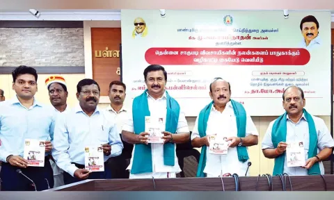 Minister MRK Panneerselvam along with other ministers releases a handbook for the welfare of coconut farmers at the secretariat on Friday