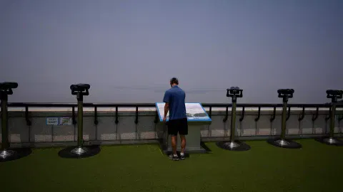 A visitor looks at the map of North Korean side from the unification observatory in Paju, South Korea (Photo: AP)