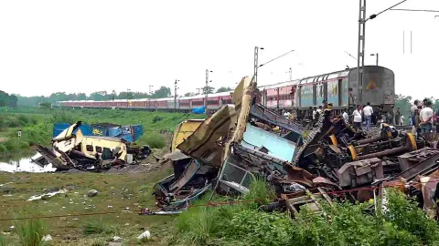 A train runs through the accident area following restoration of services a day after the collision between the Kanchanjunga Express and a goods train, near Rangapani railway station, Tuesday, June 18, 2024 (Photo/PTI)
