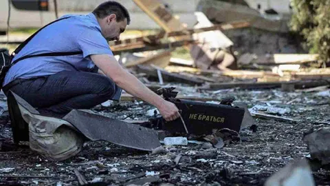 A war crimes prosecutor works at a site of a Russian drone attack, amid Russia's attack on Ukraine, on the outskirts of Lviv, Ukraine June 19, 2024&nbsp;