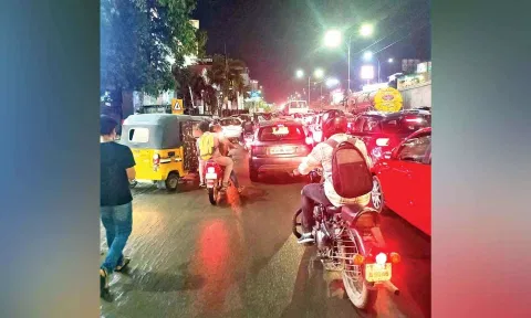 Vehicles jostling for space in the road turned narrow because of illegal parking
