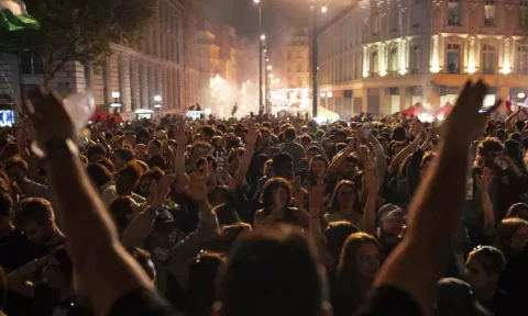 People gather at Republique Plaza after the second round of legislative elections (AP)