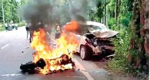 Two-wheeler on fire following the mishap on Mettupalayam-Ooty Road