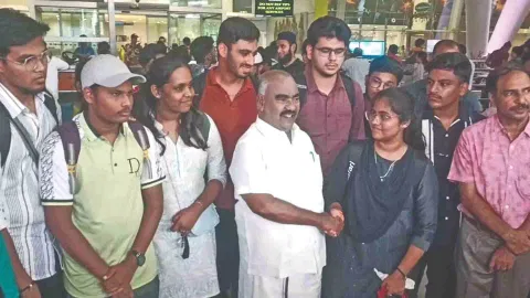 Minister KS Masthan with students who returned on Monday