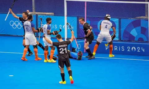 Paris: India's Abhishek (5) with Mandeep Singh (11) and New Zealand's players vie for the ball during the Pool B hockey match between India and New Zealand (PTI)