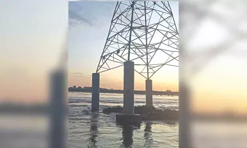 Tilted high-tension power tower in Kollidam