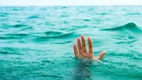 Person drowning in the water
