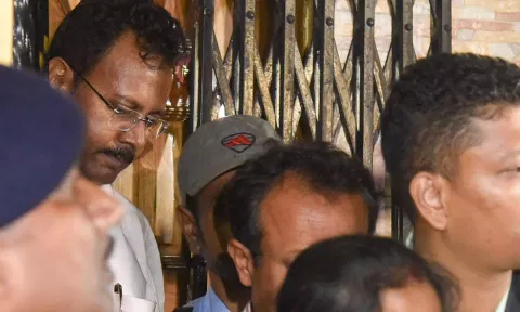 Security personnel stand guard during a raid on the premises of former medical superintendent of RG Kar Medical College Sanjay Vashisth (PTI)