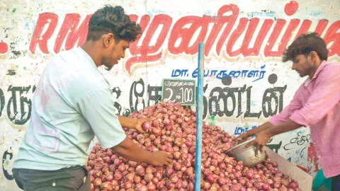 Roadside vendors selling 2 kg onions for Rs 200