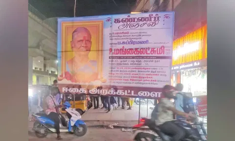 Private hoarding on footpath in Ekkatuthangal