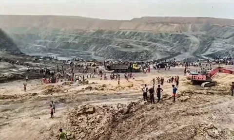 Charred remains of a vehicle parked at a coal mine where a blast occured (PTI)
