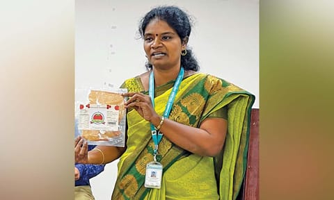 Professor Sangeetha with the tomato sheet