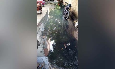 Drainage water overflowing on the Arian Lane in Vepery
