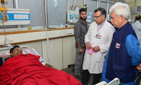Lt. Governor Manoj Sinha visits a labourer who suffered injuries in a terrorist attack in J&amp;K (PTI)