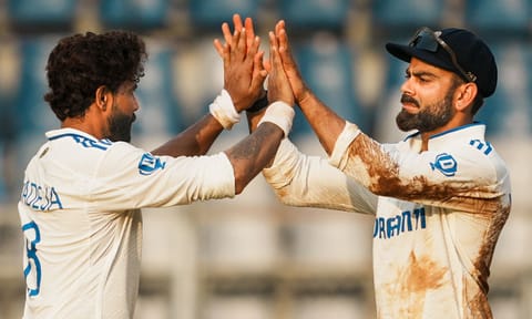 India's Ravindra Jadeja celebrates with Virat Kohli after taking the wicket of New Zealand's Matt Henry on the second day of the third test cricket match (PTI)&nbsp;&nbsp;