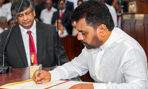 Anura Kumara Dissanayake signs documents after taking oath as Sri Lanka's new president during a ceremony, in Colombo (PTI)&nbsp;